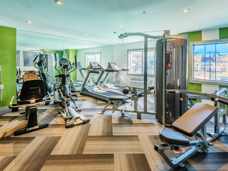 NEXTLoft apartment complex fitness center with weights and cardio equipment located in Bluffton, SC